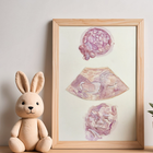 Framed artwork of an embryo, and 2 ultrasounds next to a plush toy on a shelf.