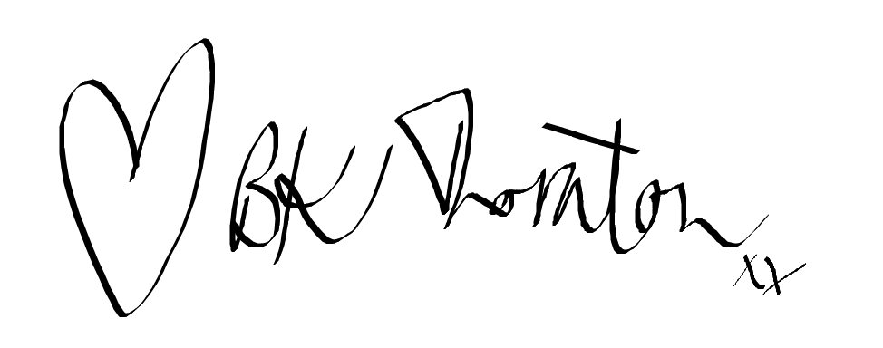 Signature with a heart symbol and text on a white background