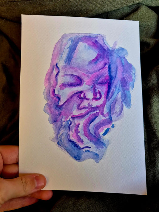 3D 4D ultrasound painting in purple blue and pink, held by fingers and thumb