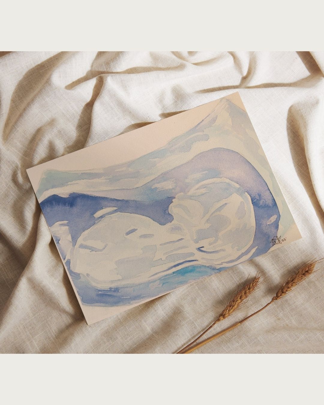 flatlay with watercolour ultrasound painting in shades of blue