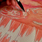 close up shot of paintbrush on paper painting pink ultrasound watercolour