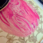 Pink and white watercolour ultrasound painting on a surface with tiny beginnings co logo in the background