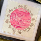 Framed artwork with a pink ultrasound sonogram watercolour painting and elephant illustrations on a beige background