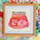 ultrasound watercolour painting in pink with elephant trail along top, in oak frame